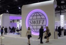 «Отрезать Кремль»: что будет с Россией после отключения от SWIFT главный офис